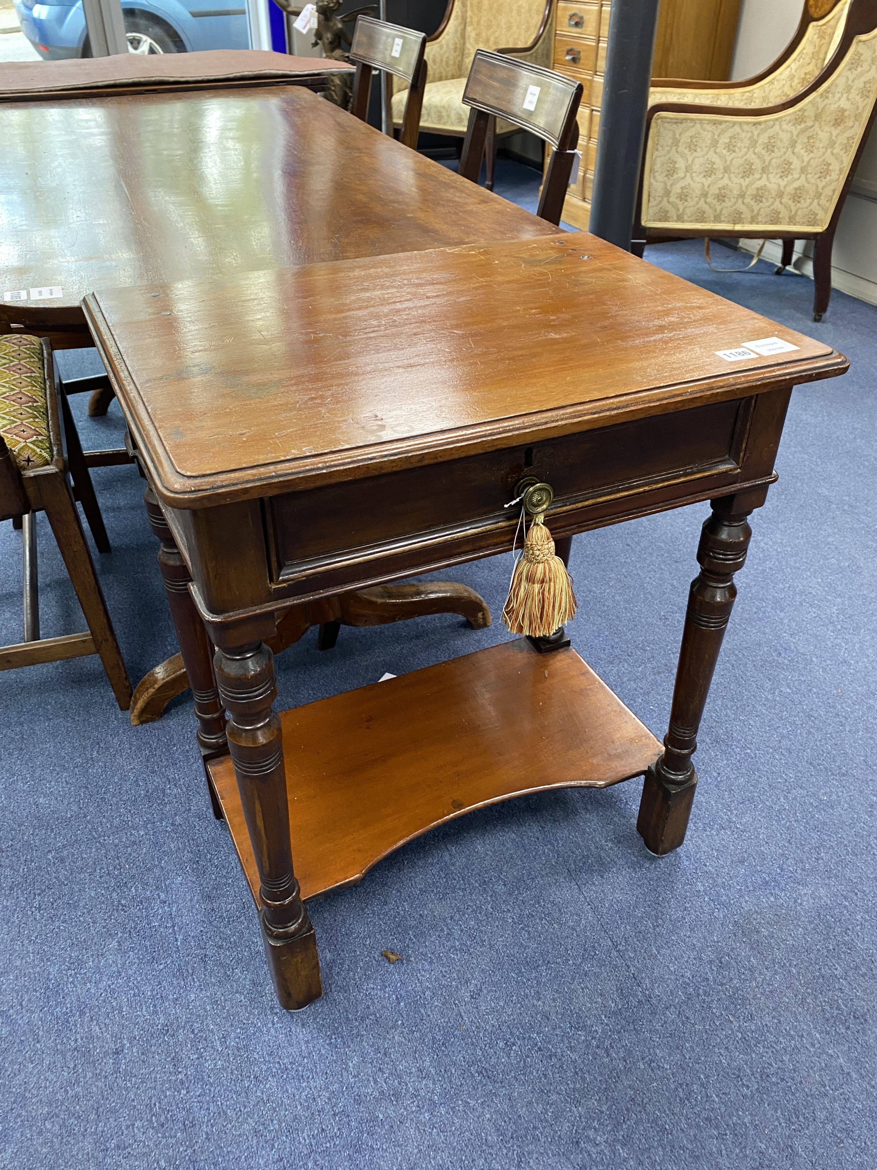 A small Victorian mahogany two tier side table, width 60cm, depth 43cm, height 72cm